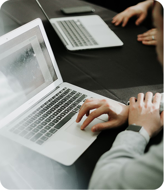 Hands working on a laptop